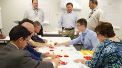 Faurecia employees participating in the FES Game part of the company39s orientation day activities The game groups people together and helps them learn more about the Faurecia Excellence System FES and its role within the company Faurecia employees participating in the FES Game part of the company39s orientation day activities The game groups people together and helps them learn more about the Faurecia Excellence System FES and its role within the company