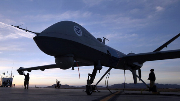 Maintenance personnel check a Predator drone