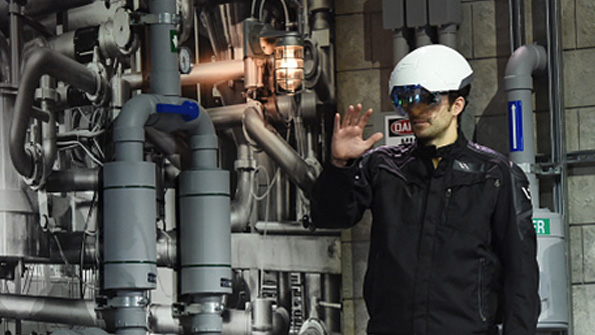 Intel CEO Brian Krzanich demonstrates the DAQRI smart helmet at CES 2016