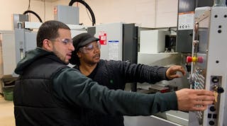 Patricio Siaca, left, and Geneo Brown graduated from MCC&rsquo;s accelerated tooling program in 2015 and became the first in their families to earn a college credential