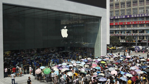 Apple fans wait outside the first Apple store in Chongqing China in July 2014