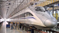 Mechanics check a bullet train in Xi An China Mechanics check a bullet train in Xi An China