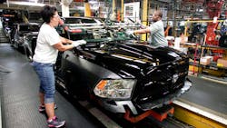Chrysler workers install a windshield in a Ram 1500 truck in Warren Michigan Chrysler workers install a windshield in a Ram 1500 truck in Warren Michigan
