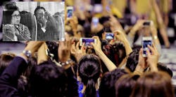 Audience members snap photos with smartphones at a recent Tokyo fashion show, a far cry from what was needed to photograph memories just a few decades earlier. The tech change has rocked Japanese camera giants.