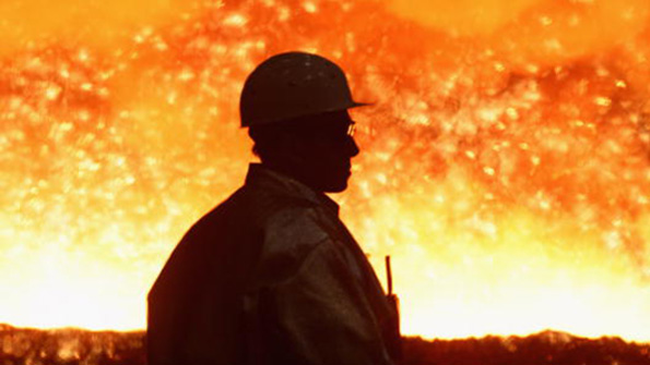 A ThyssenKrupp steel worker watched sparks fly from molten iron