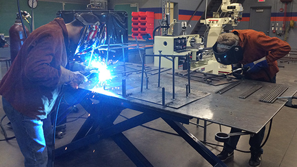 Students work in the Bay Link Manufacturing learning lab at Green Bay West High School part of the Northeast Wisconsin NEW Manufacturing Alliance STEMrelated education and other initiatives are just some of the ways manufacturers are reaching out to fill millions of jobs over the next decade