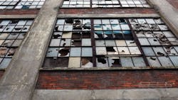 Broken windows in an abandoned factory Broken windows in an abandoned factory