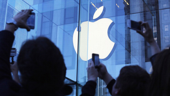 Apple devotees snap photos of the New York store while waiting in line