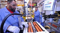 Workers assemble battery packs for the C-Max Hybrid at Ford&apos;s Rawsonville plant in Ypsilanti, Mich.
