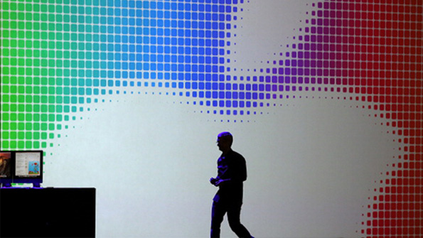 Apple CEO Tim Cook walks across the stage at the companys developers confence