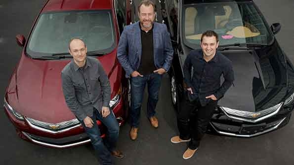 General Motors President Dan Ammann center with Lyft Inc cofounders John Zimmer right and Logan Green left