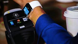 An Apple Watch using Apple Pay An Apple Watch using Apple Pay