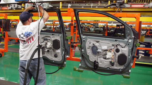 A line employee at work on Ford doors