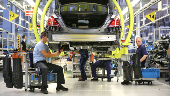 MercedesBenz workers assemble sedans at the companys Sindelfin Germany plant