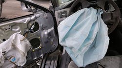 A deployed Takata airbag in a wrecked 2001 Honda Accord, similar to the 2002 Civic involved in a March collision that killed a Texas teen.