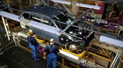 BMW workers inspect a 3 Series vehicle at the company&rsquo;s Munich plant. BMW is one of several automakers to invest in South Africa in the last eight months, and might be among the five automakers in talks to build a new plant there in the coastal city of East London.