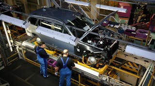 BMW workers inspect a 3 Series vehicle at the company&rsquo;s Munich plant. BMW is one of several automakers to invest in South Africa in the last eight months, and might be among the five automakers in talks to build a new plant there in the coastal city of East London.