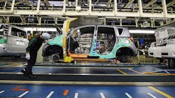 A Toyota worker inspects a car at the companys Takaoka plant A Toyota worker inspects a car at the companys Takaoka plant