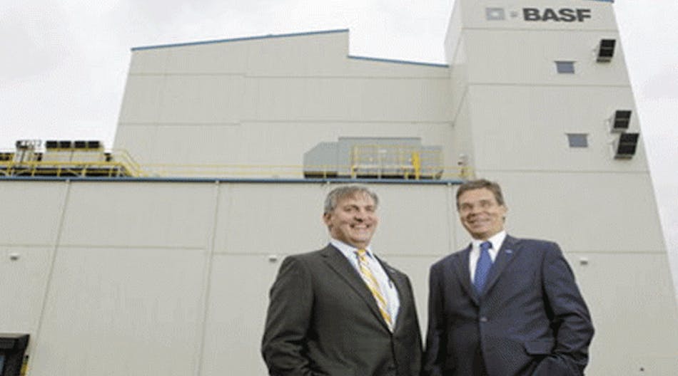 BASF Catalysts President Frank Bozich, left, and company Chairman and Chief Executive for North America Hans-Ulrich Engel stand in front of the company&apos;s new Elyria battery materials plant. Lonnie Timmons III/The Plain Dealer