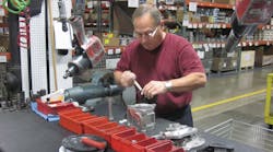 Alex Schag, a 33-year veteran of Warren Rupp&apos;s Mansfield, Ohio, factory, assembles a spill-containment pump.