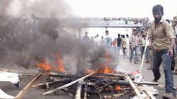 Bangladesh Police Fire Tear Gas at Textile Workers Bangladesh Police Fire Tear Gas at Textile Workers