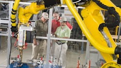 A Georgia Quick Start instructor conducts robot welding training at the Kia Geor A Georgia Quick Start instructor conducts robot welding training at the Kia Geor