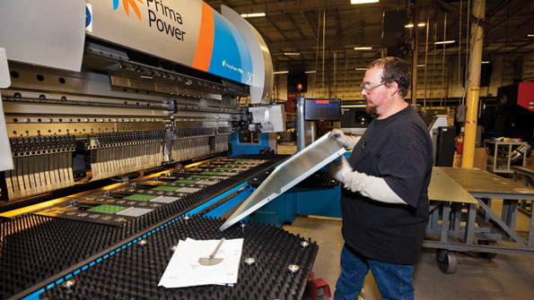 Press brake operator Bill Taylor produces a side panel using onepiece flow enabled by quick changeover bending equipmentPhoto Michael Oppenheim