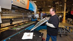 Press brake operator Bill Taylor produces a side panel using one-piece flow enabled by quick changeover bending equipment. Photo Michael Oppenheim