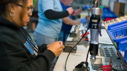 TLX employee solders parts in Wisconsin plant TLX employee solders parts in Wisconsin plant