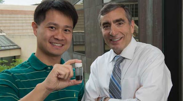 Rice University graduate student Chih-Chau Hwang, left, and Professor James Tour show a vial of material that that they say has the ability to capture carbon from gas flowing out of a well and hold it until it can be put back underground or otherwise used. (Credit: Jeff Fitlow/Rice University)