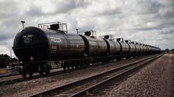 Oil containers sit at a train depot on July 26, 2013, outside Williston, N.D.