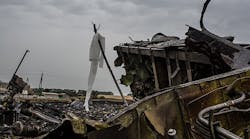 Debris from an Malaysia Airlines plane crash lies in a field on July 18, 2014 in Grabovka, Ukraine. Malaysia Airlines flight MH17 travelling from Amsterdam to Kuala Lumpur has crashed on the Ukraine/Russia border near the town of Shaktersk.