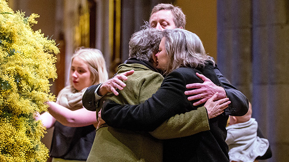 Grieving relatives console each other during a national memorial service Aug 7 as Australians mourn the loss of all victims of Malaysia Airlines Flight MH17