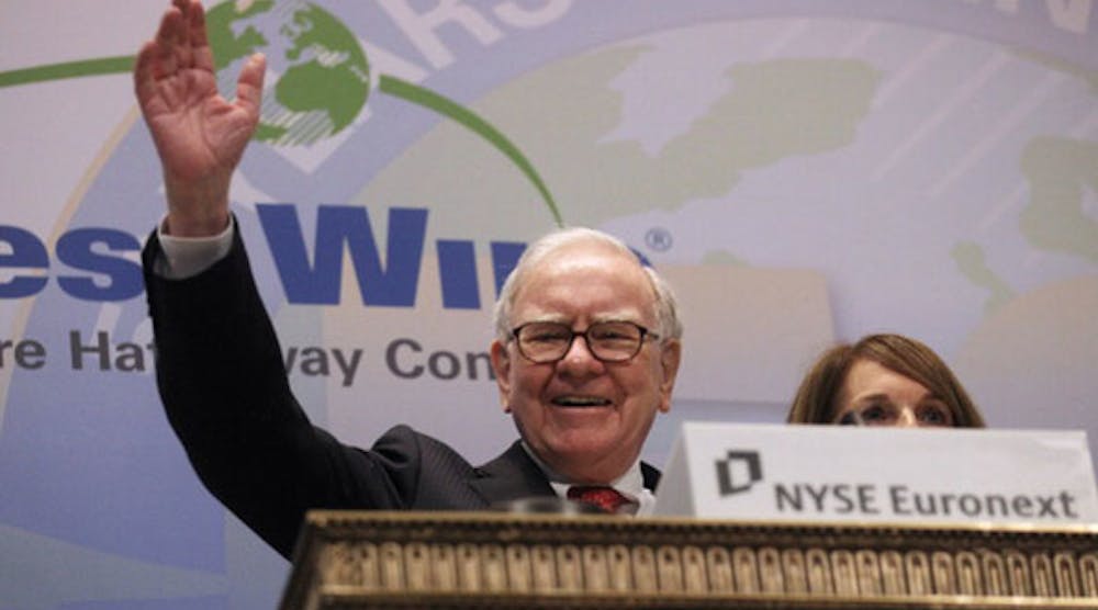 Berkshire Hathaway CEO Warren Buffett waves after ringing the opening bell at the New York Stock Exchange in this September 2011 file photo. (Photo by Mario Tama/Getty Images)