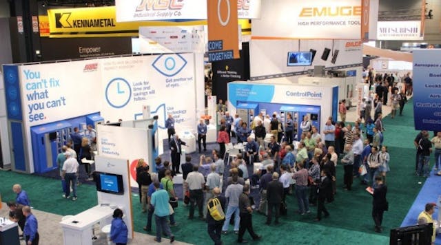 Attendees at the 2014 IMTS trade show crowd the booth of MSC Industrial Supply, a company with deep roots in metalworking and manufacturing.