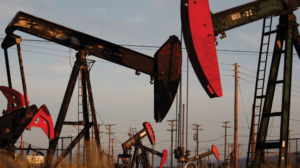 Pump jacks and wells are seen in an oil field on the Monterey Shale formation near McKittrick Calif Gas and oil extraction using hydraulic fracturing or fracking is contributing to a US energy production boom