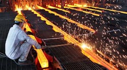 A worker cuts steel billets at an iron and steel enterprise in Ganyu County, China.