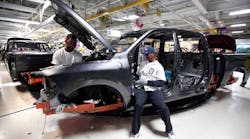 Manufacturing returned to growth mode in September, the Federal Reserve reported. Automotive production was still down but rebounded from its August dip of 7%.
