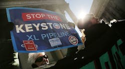 Protesters participate in an anti-Keystone pipeline demonstration in New York&apos;s Foley Square on November 18. The Senate is expected to vote today on the controversial pipeline project. The 1,700-mile underground oil pipeline would link the Canadian tar sands fields to oil refineries on the Texas Gulf Coast. (Photo by Spencer Platt/Getty Images)
