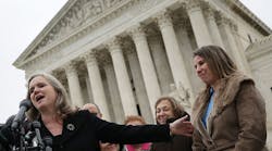 Peggy Young, right, the plaintiff in Young vs UPS, and her attorney Sharon Fast Gustafson, left, answer questions outside the U.S. Supreme Court after the court heard arguments in her case on December 3 in Washington. The case involves Young, a former UPS driver who requested temporary assignment to avoid lifting heavy packages after she became pregnant. (Photo by Win McNamee/Getty Images)