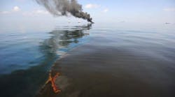 Oil burns during a controlled fire May 6, 2010, in the Gulf of Mexico. The U.S. Coast Guard oversaw oil burns after the massive oil leak from the sinking of the Deepwater Horizon oil platform off the coast of Louisiana. (Photo by Justin E. Stumberg/U.S. Navy via Getty Images)