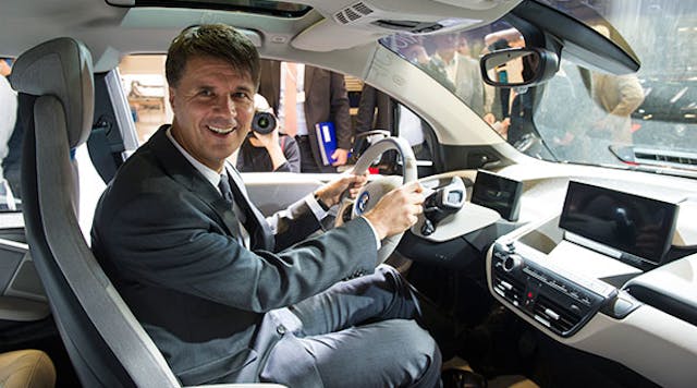 Incoming CEO, Harald Krueger, sits in a new BMW i3 on the assembly line at the BMW factory in Leipzig, Germany.