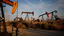 Pump jacks and wells are seen in an oil field on the Monterey Shale formation in California. OPEC says an influx of oil production from newcomers, including shale oil, is driving down oil prices.
