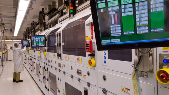 A Boston Scientific technician monitors the automated electrochemical etching process for stent production