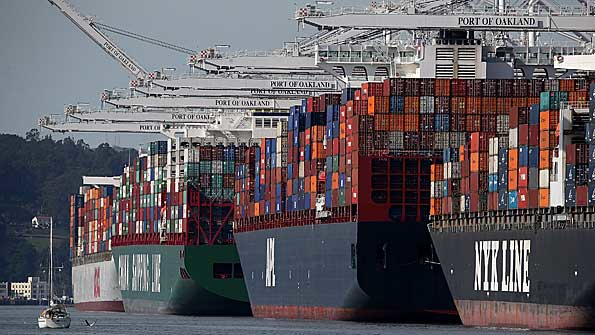Container ships sit moored at the Port of Oakland on February 11 2015