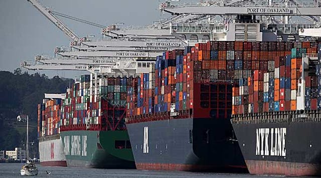 Container ships sit moored at the Port of Oakland on February 11, 2015.
