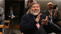 Apple Co-Founder Steve Wozniak applauds after the FCC voted to approve Net Neutrality during a hearing at the FCC headquarters February 26, 2015 in Washington, DC.
