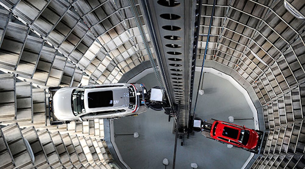 A brand new Volkswagen Passat and Golf 7 car are stored in a tower at the Volkswagen Autostadt complex near the Volkswagen factory in Wolfsburg, Germany.