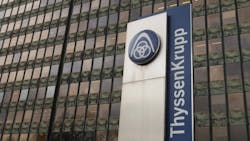 ThyssenKrupp logo and wordmark outside an office tower ThyssenKrupp logo and wordmark outside an office tower
