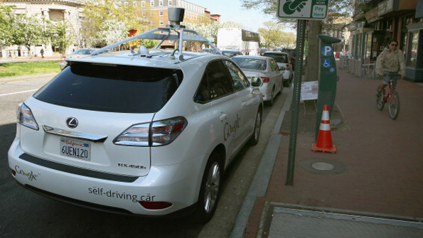 A Google autonomous car parked near the curb